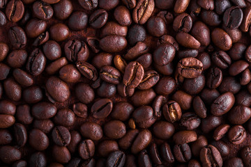 Photo closeup of coffee beans. Rusty background. Copy space.