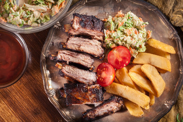 Spicy barbecued pork ribs with french fries