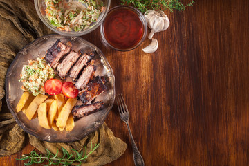 Spicy barbecued pork ribs with french fries