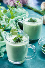 Cold cucumber soup with dill and mint served in glassful. Summer dish