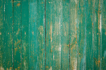 Fototapeta na wymiar Textura de fondo de madera decapada verde con listones verticales