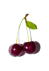 Ripe red cherry on a white isolated background, close-up.