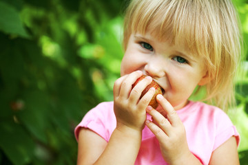 a girl eats an apple