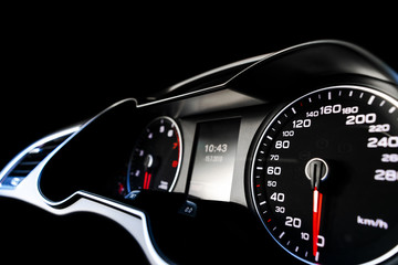 Close up shot of a speedometer in a car. Car dashboard. Dashboard details with indication lamps.Car...