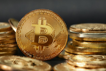 igital Currency. Gold Bitcoin Coins On Dark Background 