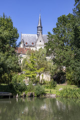 Fototapeta na wymiar Montrésor. Collégiale Saint-Jean-Baptiste vue de la rivière. Indre-et-Loire. Pays de Loire