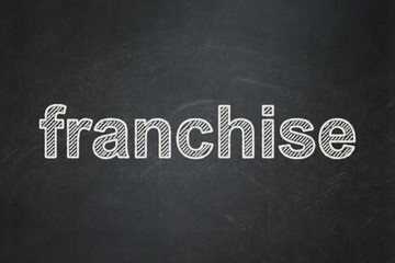Obraz premium Business concept: text Franchise on Black chalkboard background