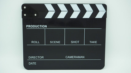 Fototapeta na wymiar Clapper or slate use in video production or movie and cinema industry. It's black color on white background.