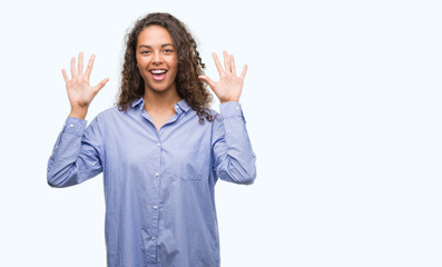 Young hispanic business woman showing and pointing up with fingers number ten while smiling...
