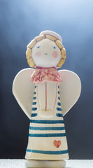 Figurine Of Cute Angel On Black Misty Background