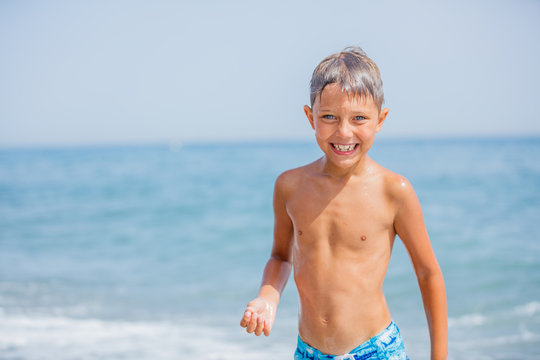 Happy child on beach. Summer vacation concept