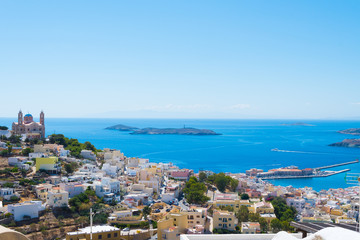 Fototapeta na wymiar Panoramic view of Ermoupoli city of Syros Island in Cyclades, Greece. Top view of the colorful houses, the port and the Orthodox Anastaseos church