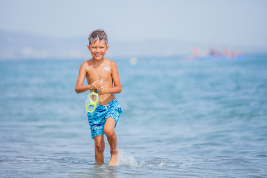Happy child on beach. Summer vacation concept