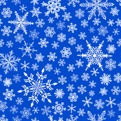 Fototapeta na wymiar Christmas seamless pattern of snowflakes, white on blue background.