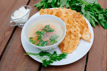 The Caucasian food is a patty made from thin unleavened dough with stuffed lamb and spicy seasonings. Cheburek - fried pie with meat and onions. Traditional dish of many tatar and eastern peoples.