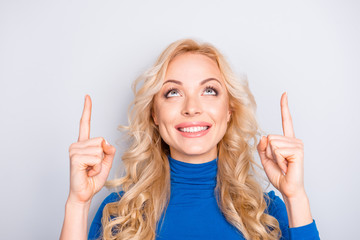 Portrait of stylish, pretty, trendy,charming, nice, sexy, cute, blonde woman in blue roll neck...