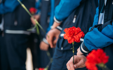 People holding a rose
