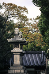 Fototapeta na wymiar Old traditional japanese oriental architecture stone lamp light lantern monolith 