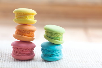 Pile of french colorful macarons on table.