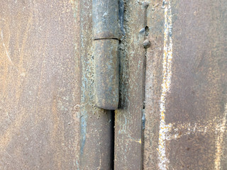 Iron garage doors. Rusty door. Door hinges. Close up shot