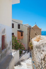  Paved narrow alley of Ano Syros in Syros island, Cyclades, Greece. Street view