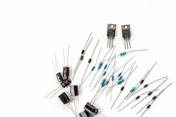 Set of Electronic components with resistors,capacitors,diodes and transistors on white background.