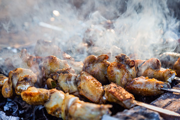 The process of cooking chicken barbecue. Picnic.