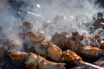 The process of cooking chicken barbecue. Picnic.