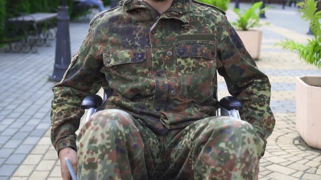 Portrait Disabled Military In A Wheelchair.Slow Mo