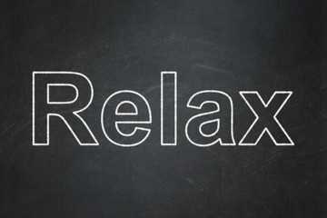 Tourism concept: text Relax on Black chalkboard background