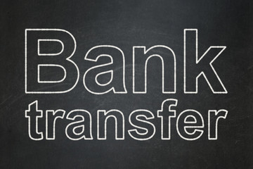 Currency concept: text Bank Transfer on Black chalkboard background