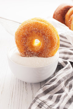 Donuts on white wooden table. Copy space
