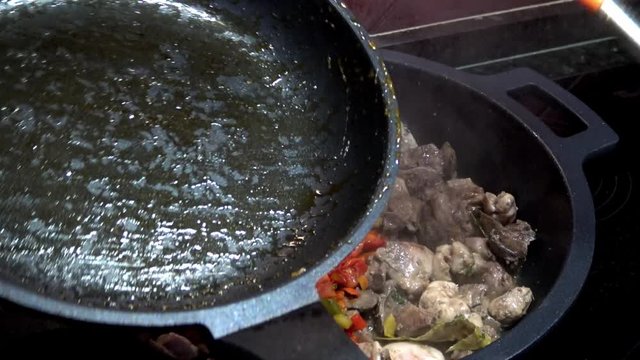 4k, Chef cooking red and green peppers with chicken hearts and livers in a frying pan. Roasting stewpan with tasty and healthy vegetables and chicken liver. Delicious nutritious organic dietary -Dan