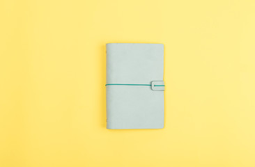 journal on yellow background