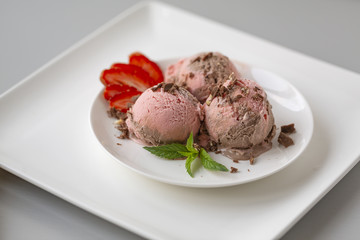 Chocolate and strawberry ice cream, with berries, sprinkled with chocolate