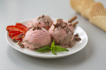 Chocolate and strawberry ice cream, with berries, sprinkled with chocolate