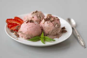 Chocolate and strawberry ice cream, with berries, sprinkled with chocolate