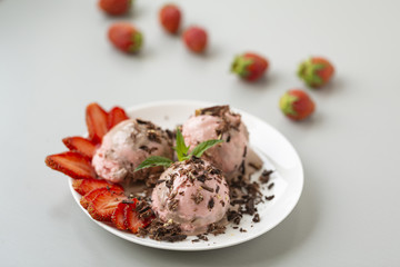 Chocolate and strawberry ice cream, with berries, sprinkled with chocolate