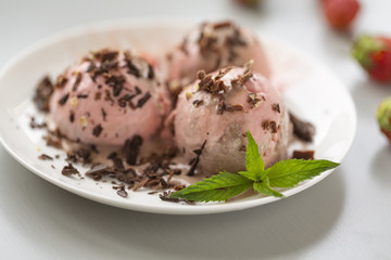 Chocolate and strawberry ice cream, with berries, sprinkled with chocolate