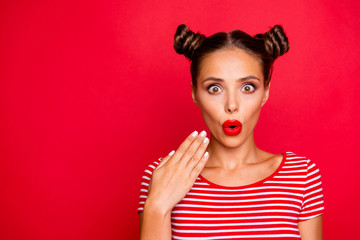 Fototapeta Portrait of shocked impressed woman with unexpected reaction gesturing palm looking at camera with wide open eyes mouth isolated on red background obraz