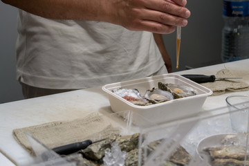 the chef prepares oysters