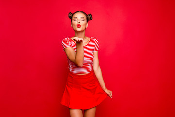 Cute girl send a kiss for you! Adorable young girl with nice make up wearing striped tshirt and red...