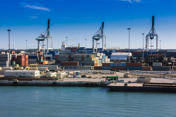 Fototapeta na wymiar Industrial port in Miami, shipyard, cargo cranes and containers