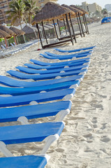 Relaxing chairs at beach for sun bath. Relax, travel