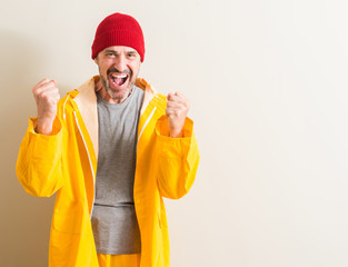 Senior fisherman screaming proud and celebrating victory and success very excited, cheering emotion
