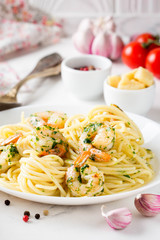 Italian pasta, spaghetti with shrimp, herbs, garlic and cheese. Tasty healthy food