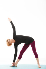 Fototapeta na wymiar Portrait of a healthy yoga woman dressed in sport clothes