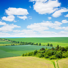Rural scene white fluffy clouds.