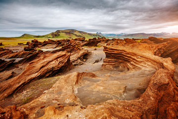 Sandy rocks with by magma formed by winds. Location place Sudurland, Iceland.