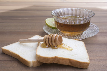 Fototapeta na wymiar Bread with honey Paste with a drink